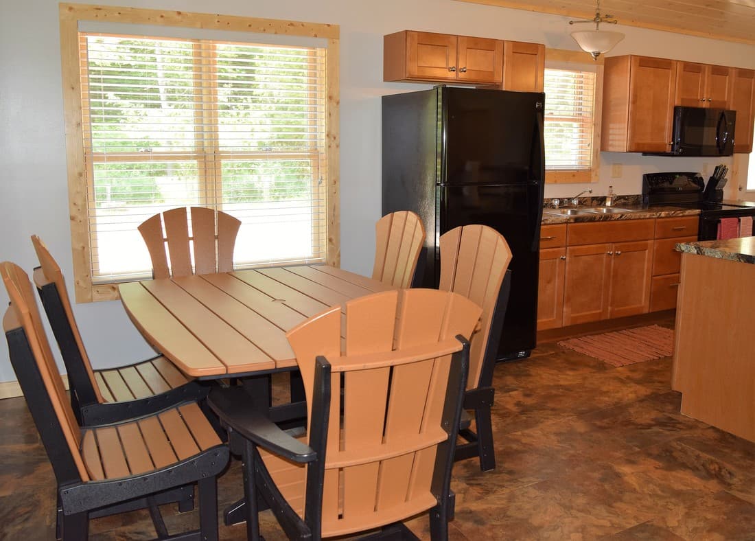 Red Cabin dining table with seating for six beside the kitchen